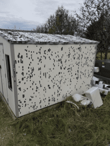 Hail damage to vinyl shed rapid city sd weather tite exteriors