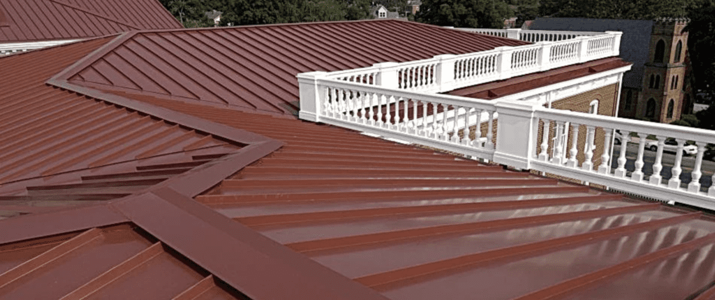 Brick red roofing with white fencing along the edges