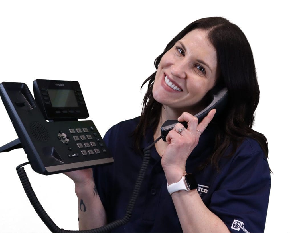 smiling woman with long black hair answering a phone