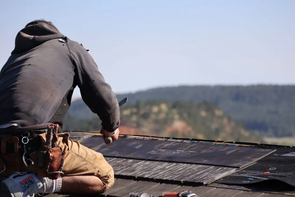 Roof Repair Specialist working on a roof in piedmont